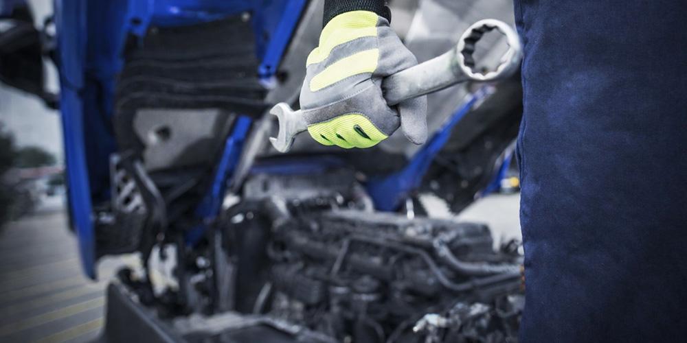 Technician servicing a vehicle
